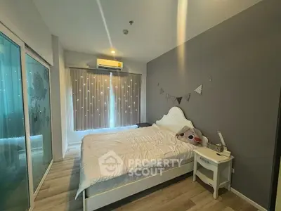 Cozy bedroom with stylish decor and ample natural light