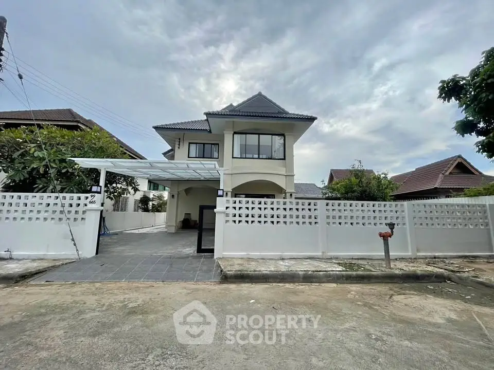 Charming two-story house with modern design and spacious driveway