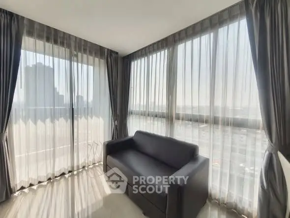Bright corner unit with panoramic city views and modern furnishings.