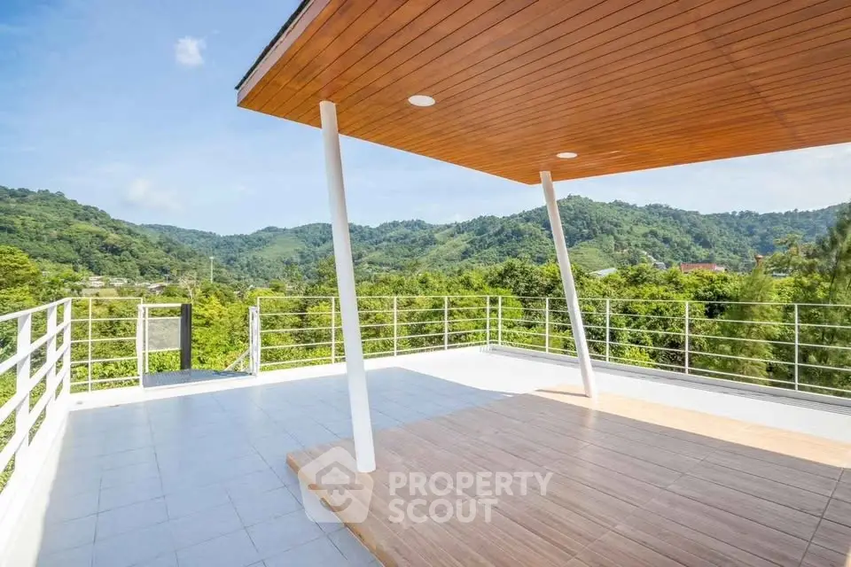 Stunning rooftop terrace with panoramic mountain views and modern design.