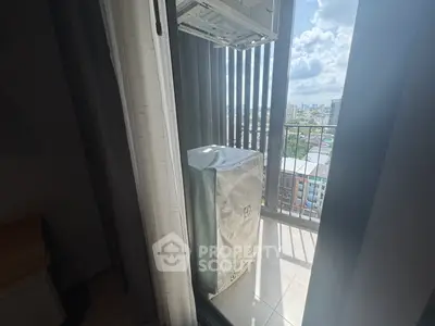Cozy balcony with city view and covered air conditioning unit