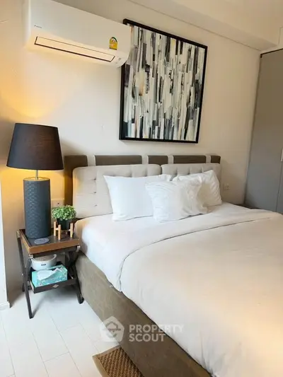 Cozy bedroom with modern decor and air conditioning unit