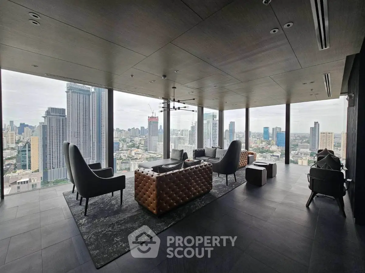 Luxurious high-rise living room with panoramic city views and modern furnishings.