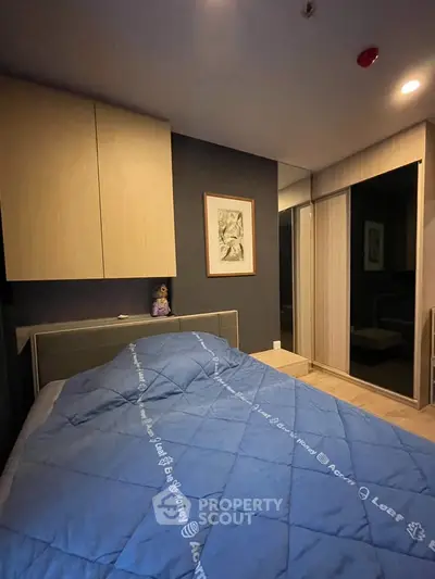Cozy bedroom with modern decor and ample storage space