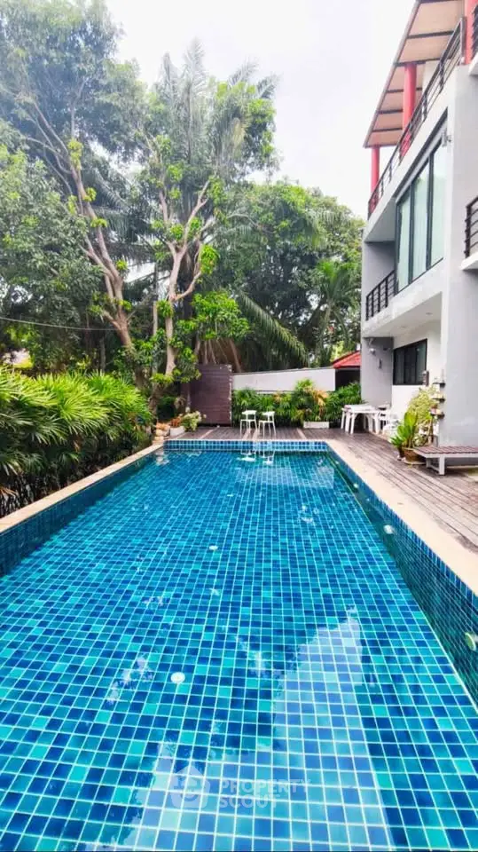 Luxurious modern villa with stunning private pool and lush greenery