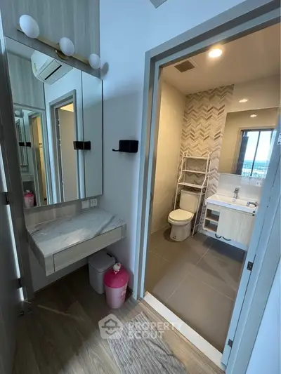 Modern bathroom with stylish vanity and elegant tile design