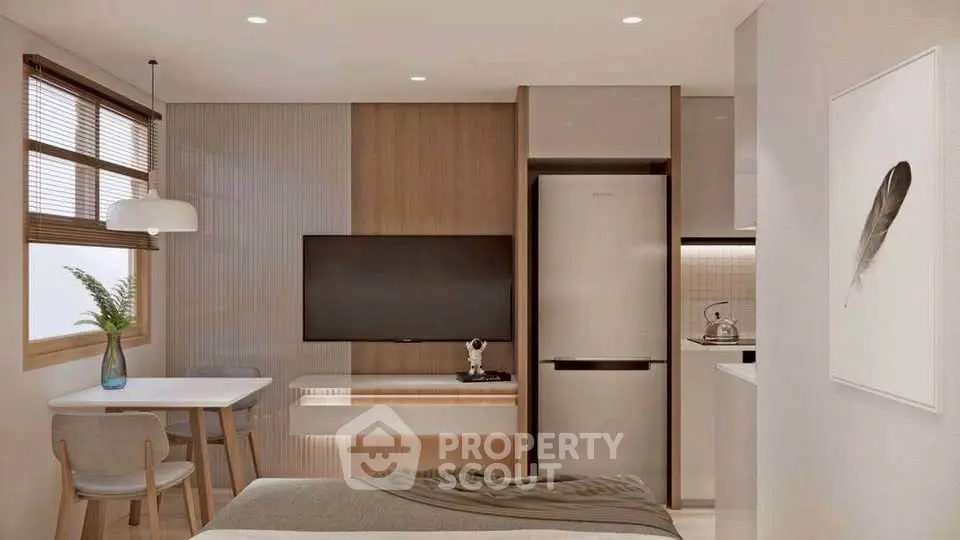 Modern studio apartment with sleek kitchen and cozy dining area, featuring a stylish interior design.