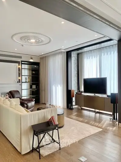 Luxurious modern living room with elegant decor and large windows