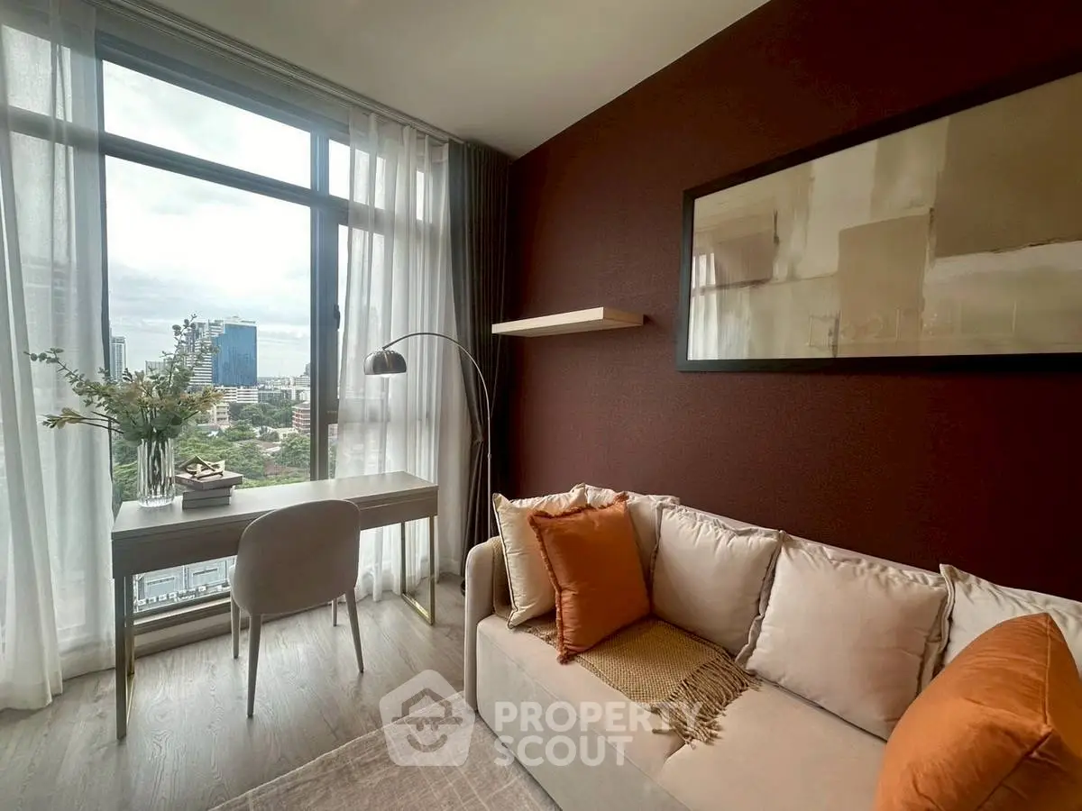 Stylish living room with modern decor and city view, featuring a cozy sofa and elegant workspace.