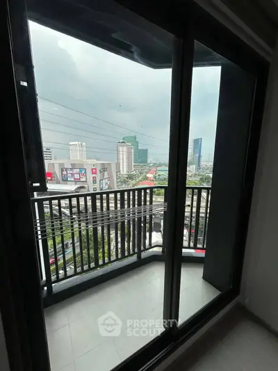 Modern apartment balcony with city view, perfect for urban living.