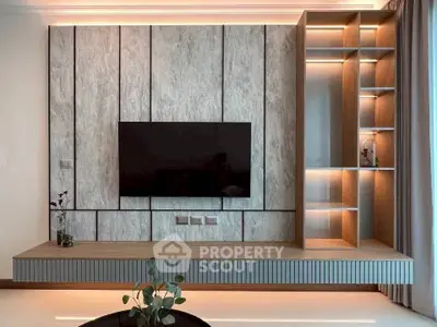 Modern living room with sleek TV wall unit and ambient lighting