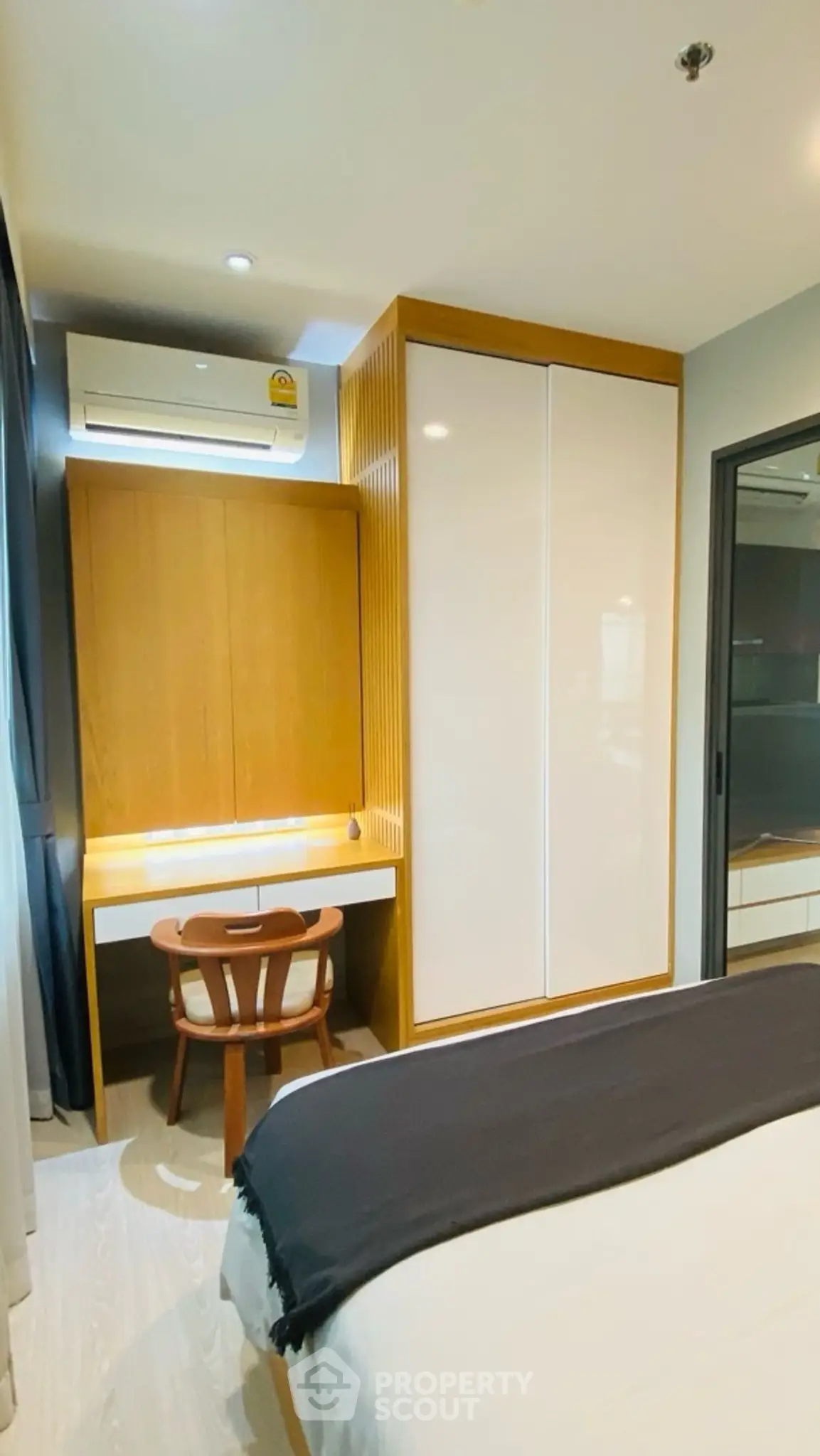 Cozy bedroom with modern furniture and built-in wardrobe