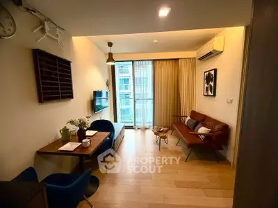 Stylish modern living room with wooden flooring and cozy seating area.