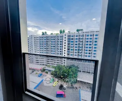 Stunning cityscape view from high-rise apartment window with vibrant skyline.