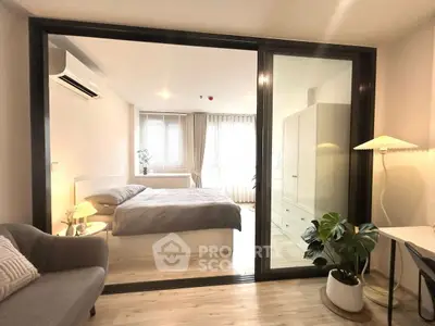 Modern bedroom with glass partition and cozy decor