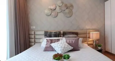 Elegant bedroom with stylish decor and cozy lighting, perfect for relaxation and comfort.