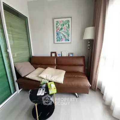 Cozy living room with brown leather sofa and modern decor