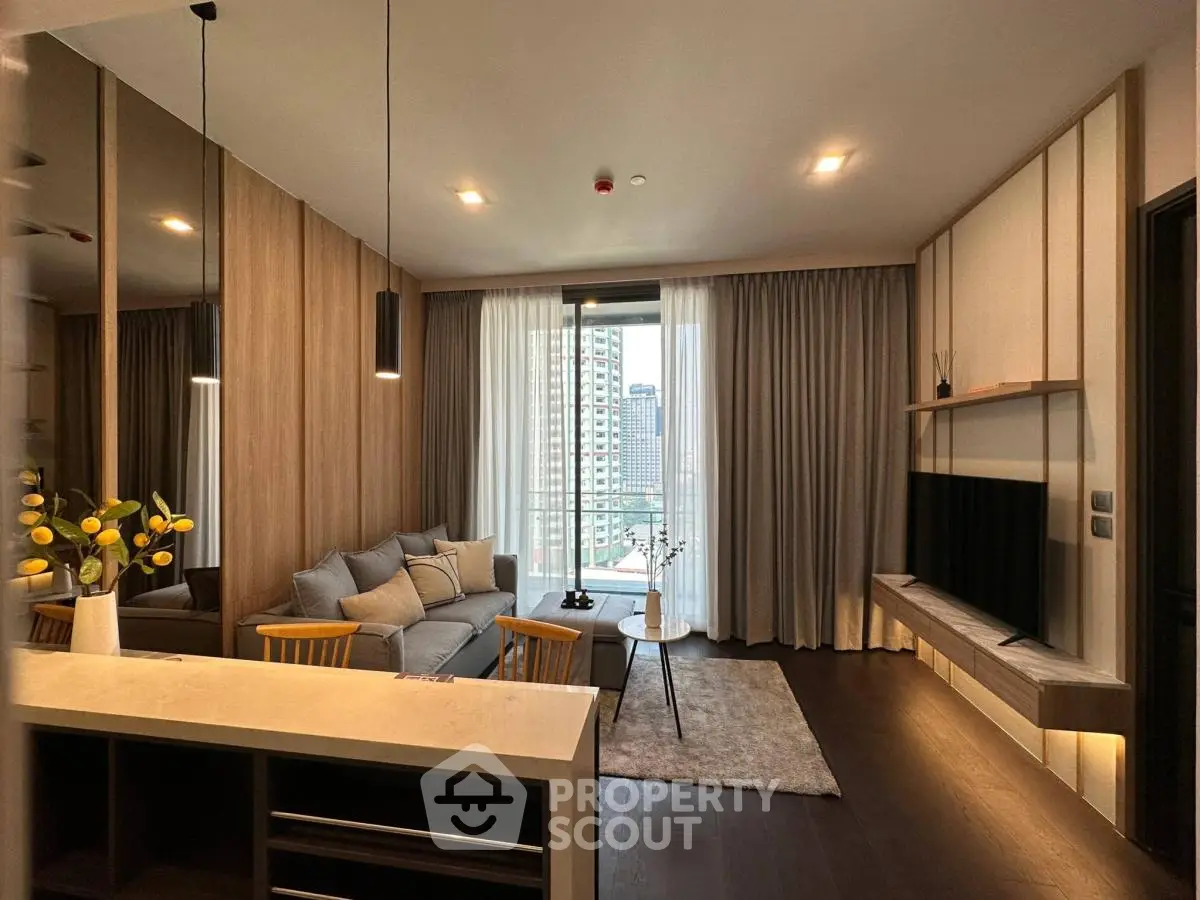 Modern living room with stylish decor and city view balcony in luxury apartment.