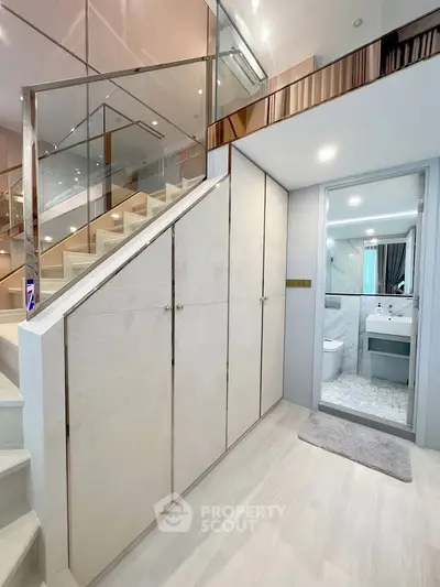 Modern duplex interior with sleek staircase and stylish bathroom