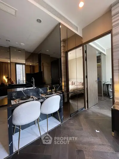 Modern open-layout kitchen with sleek design and cozy dining area