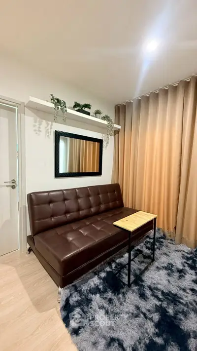 Stylish living room with brown leather sofa and modern decor