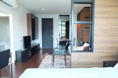 Modern living room with stylish decor and open layout in a contemporary apartment.