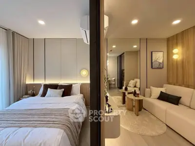 Modern apartment with cozy bedroom and stylish living room, perfect for urban living.