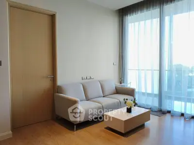 Modern living room with cozy sofa and large window view