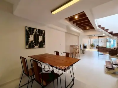 Spacious modern living room with open layout and stylish dining area