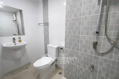 Modern bathroom with sleek gray tiles and contemporary fixtures