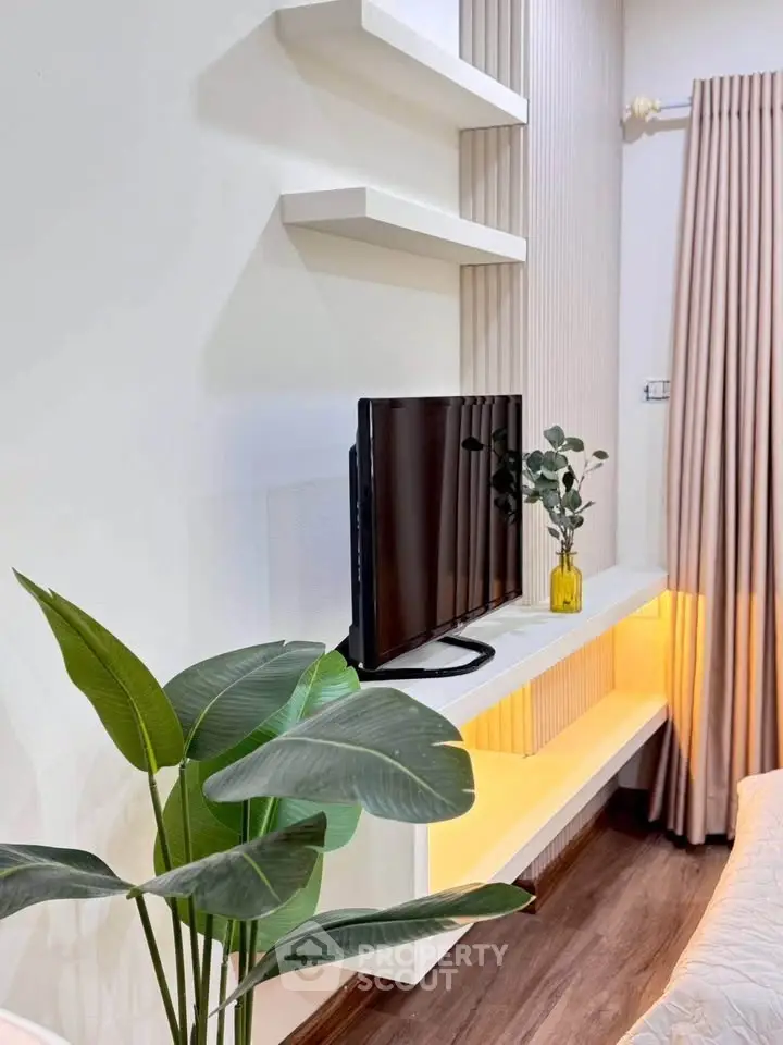 Modern living room with sleek TV setup and elegant decor