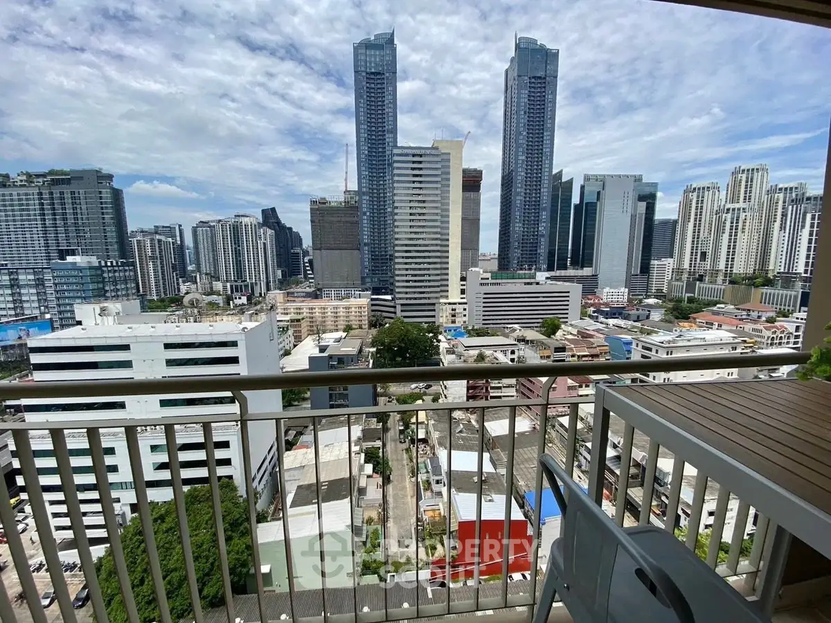 Stunning cityscape view from a high-rise balcony with modern skyscrapers.