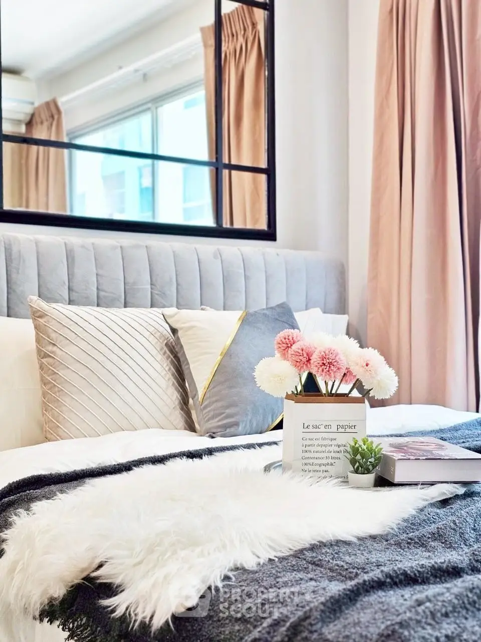 Cozy and stylish bedroom with plush bedding and elegant decor