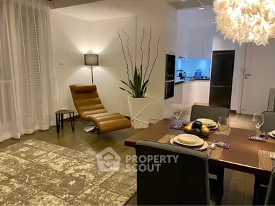 Stylish modern living room with elegant dining area and sleek kitchen