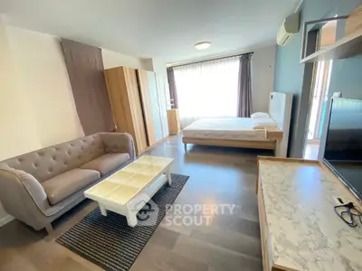 Spacious studio apartment with modern furnishings and natural light