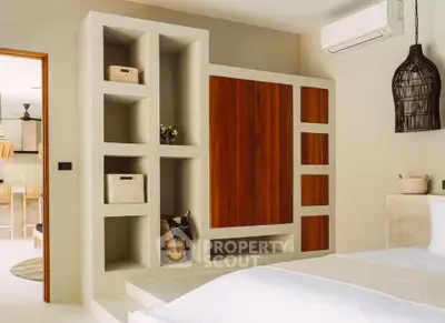Modern bedroom with stylish built-in storage and elegant decor