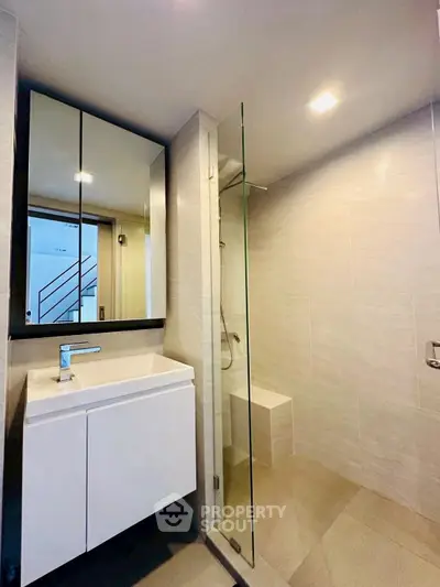 Modern bathroom with sleek glass shower and stylish vanity