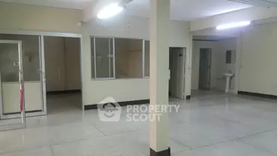 Spacious interior with potential for customization, featuring open layout and ample lighting.