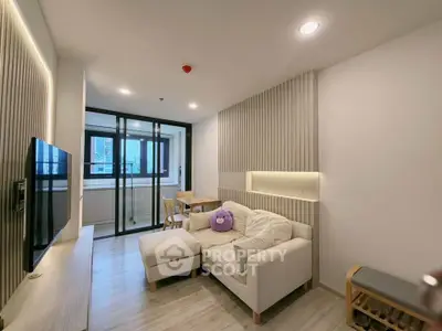 Modern living room with stylish decor and cozy seating in a contemporary apartment.