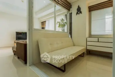 Modern living room with sleek white sofa and stylish decor