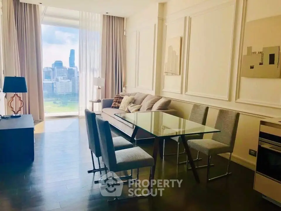 Luxurious living room with city view, elegant decor, and modern furniture in high-rise apartment.
