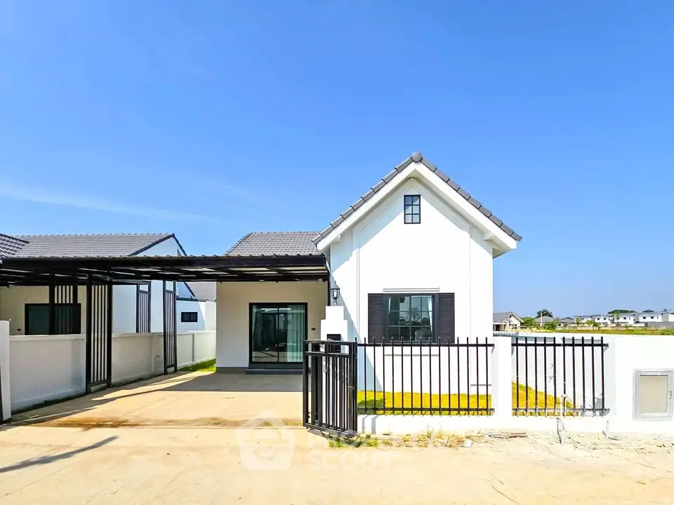 Charming modern house with spacious driveway and sleek design in a serene neighborhood.