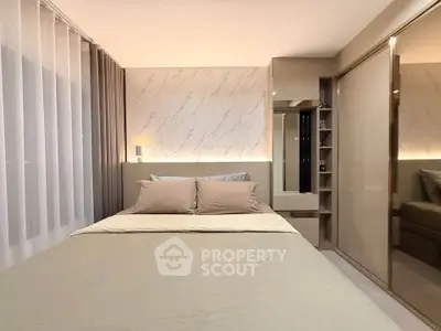 Modern bedroom with elegant decor and ample storage space