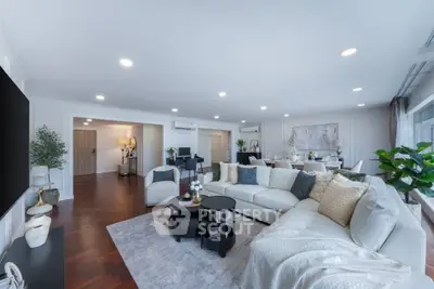 Spacious modern living room with elegant decor and ample natural light