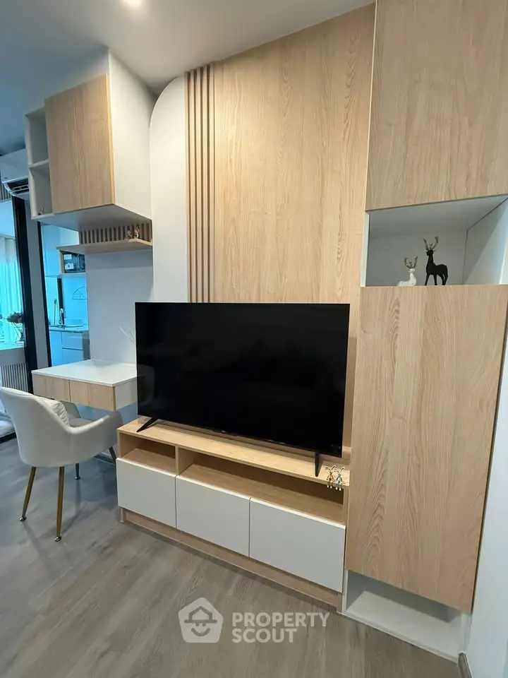 Modern living room with stylish wooden TV unit and elegant decor