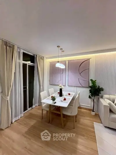 Elegant dining area with modern decor and ambient lighting in a stylish apartment.