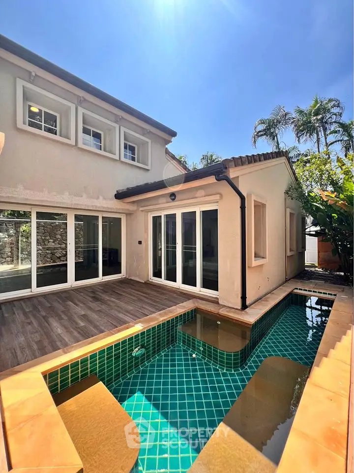 Charming villa with private pool and lush garden in serene neighborhood.