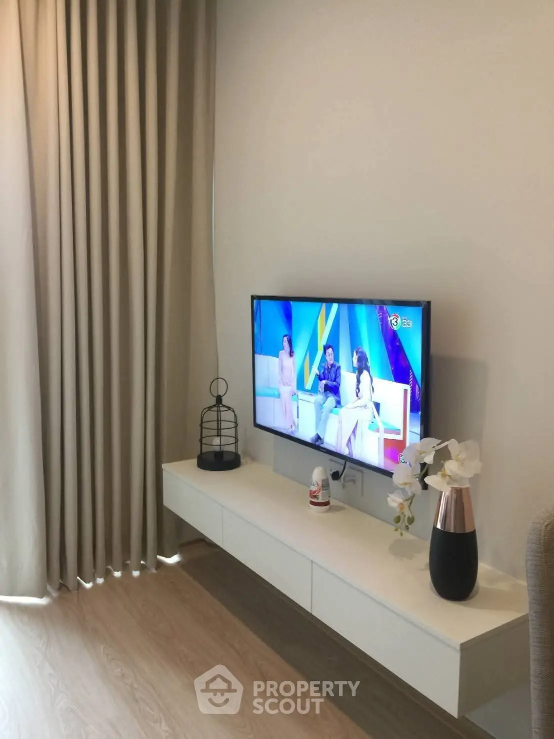 Modern living room with wall-mounted TV and elegant decor