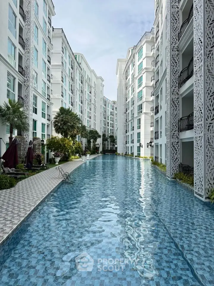 Luxurious apartment complex with stunning pool and modern architecture