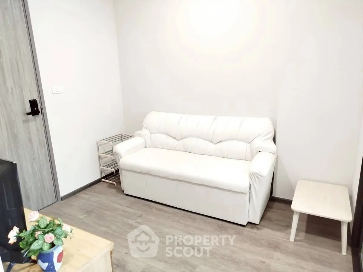 Cozy living room with white sofa and modern decor